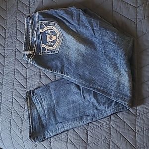 Rock and roll denim cowgirl mid-rise bootcut 27x34 with Cowskull on back pocket